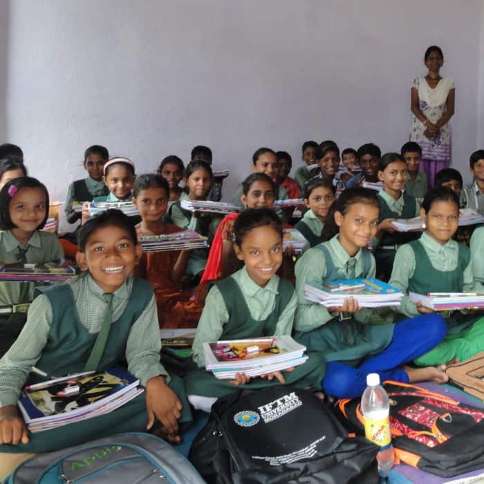A group of school children participating in a social project.