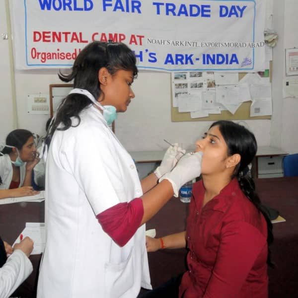 A woman undergoes dental examination at a health camp.