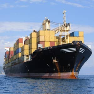 A massive cargo vessel navigating the ocean.