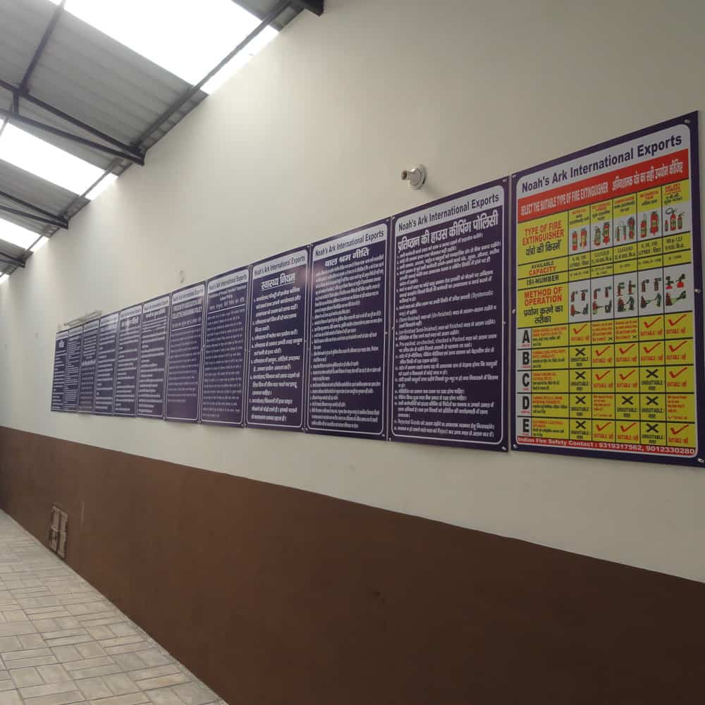A wall adorned with fair trade posters.