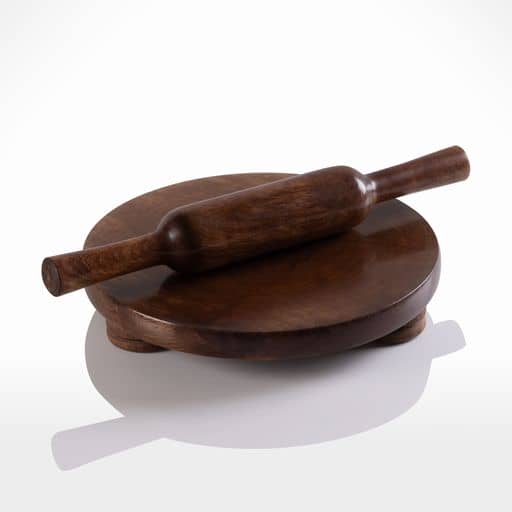 A Rolling Board and Pin on a white surface for rolling.