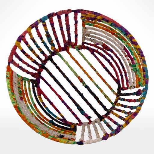 A colorful woven Bread/Fruit Basket on a white background.
